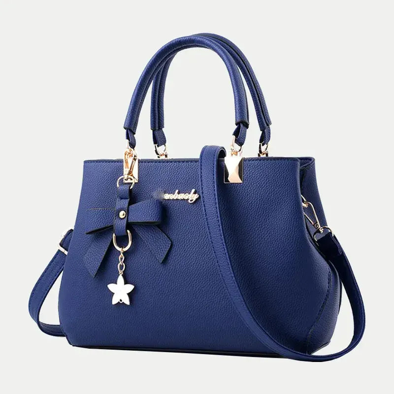 Le Sac Trapèze Noir Grainé avec Bijou Nœud LUNAVIA PANTS