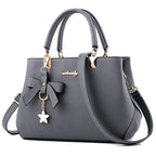 Le Sac Trapèze Noir Grainé avec Bijou Nœud LUNAVIA PANTS