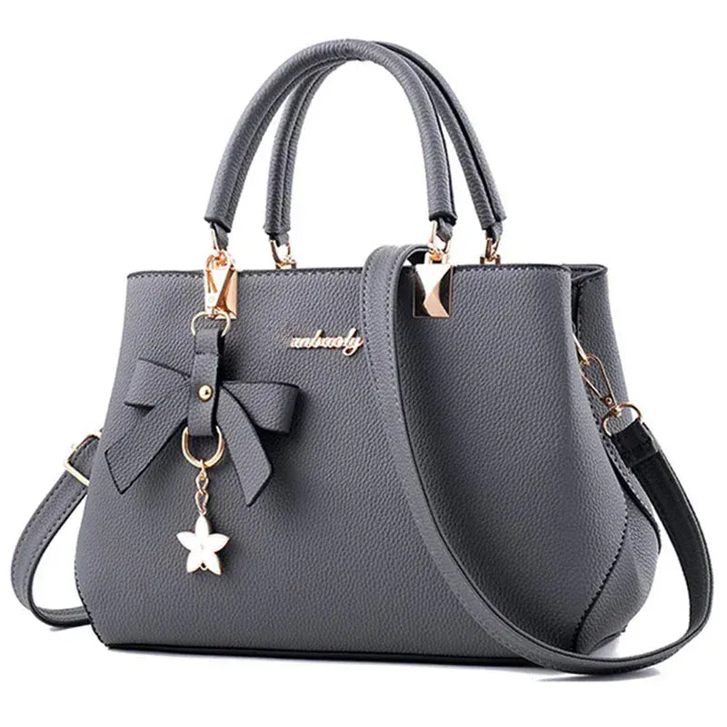 Le Sac Trapèze Noir Grainé avec Bijou Nœud LUNAVIA PANTS